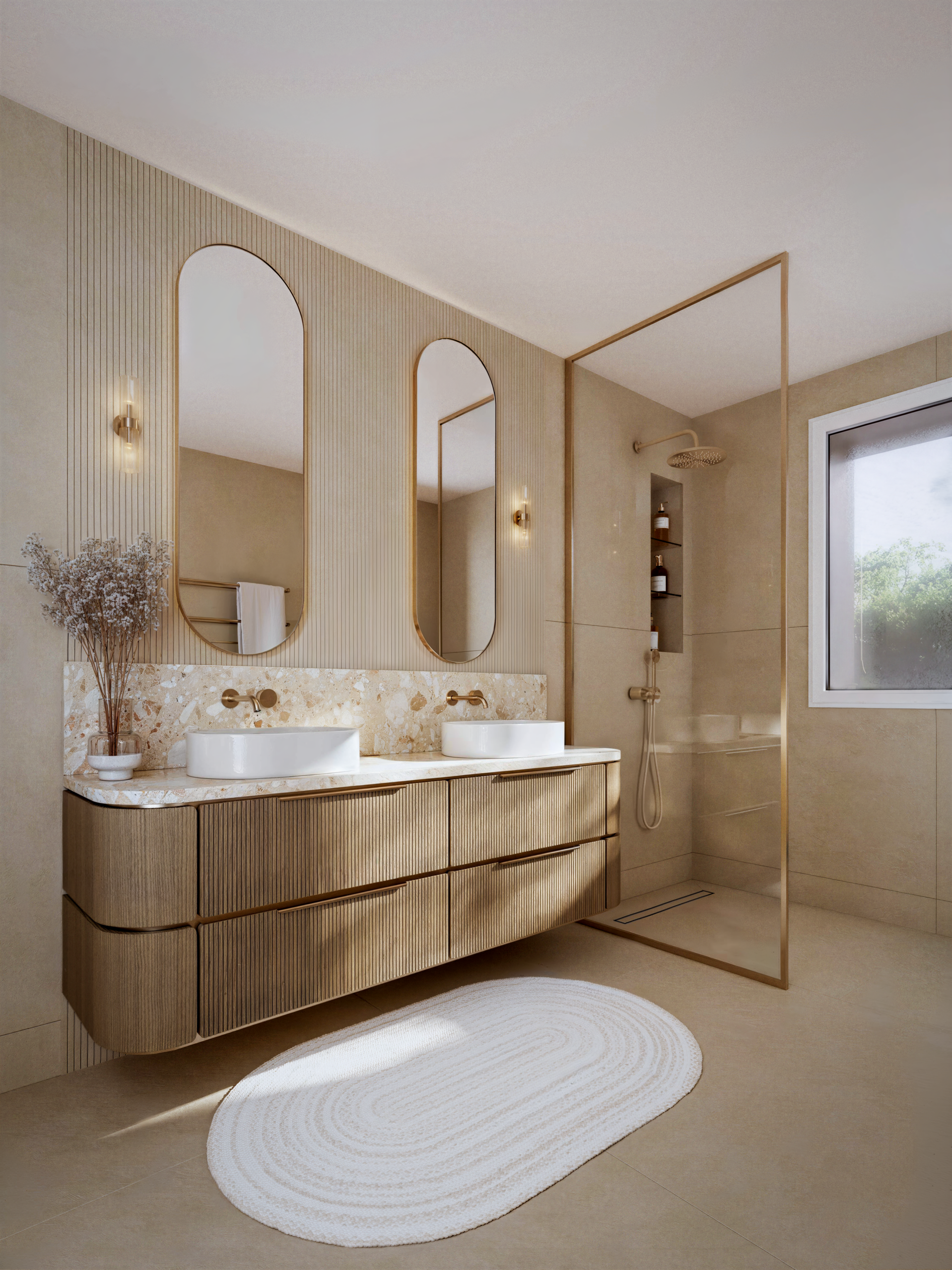 Salle de bains élégante avec double vasque, mobilier en bois clair, miroirs arrondis et douche vitrée.